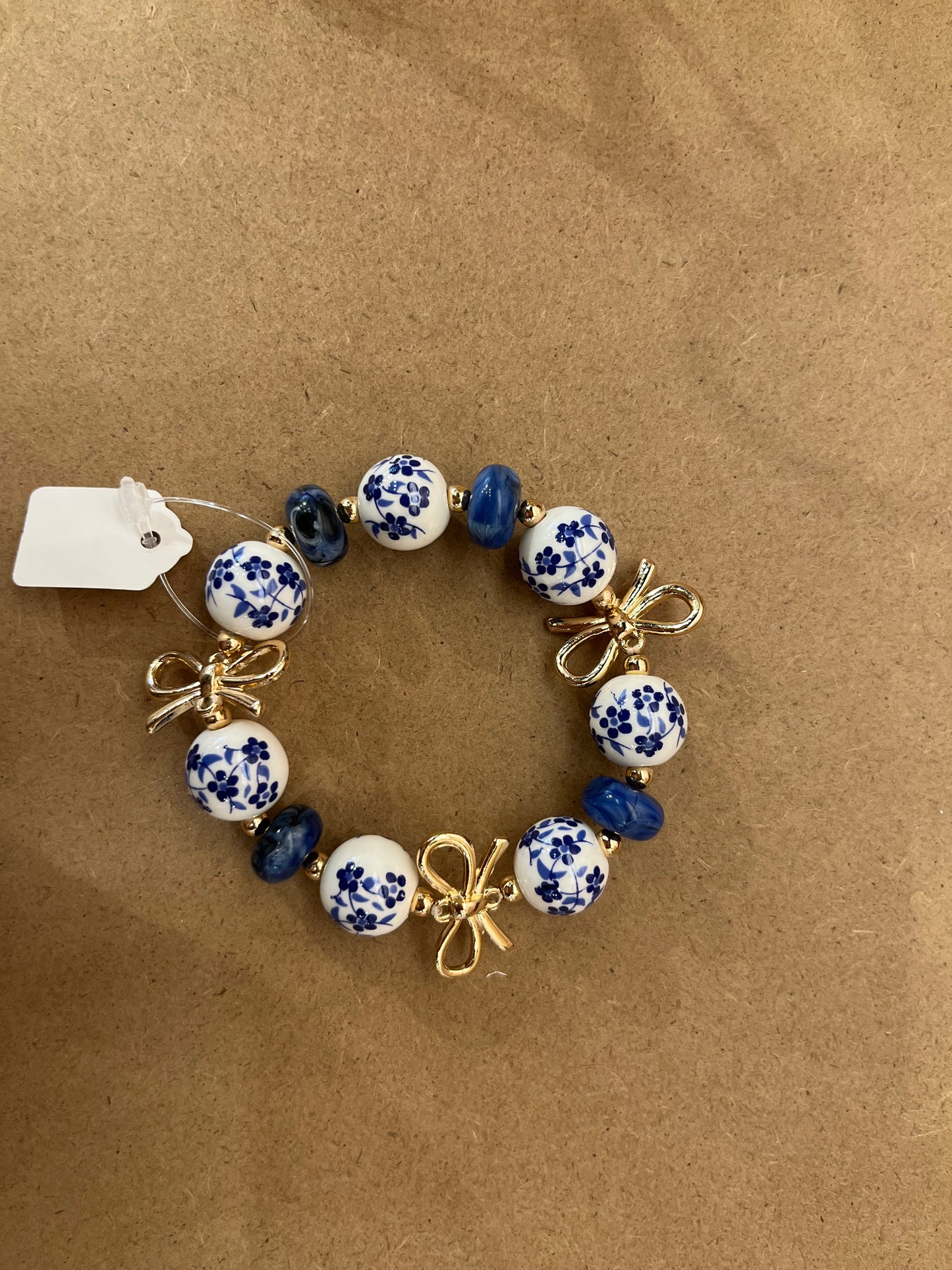 Blue floral gold bowed bracelet