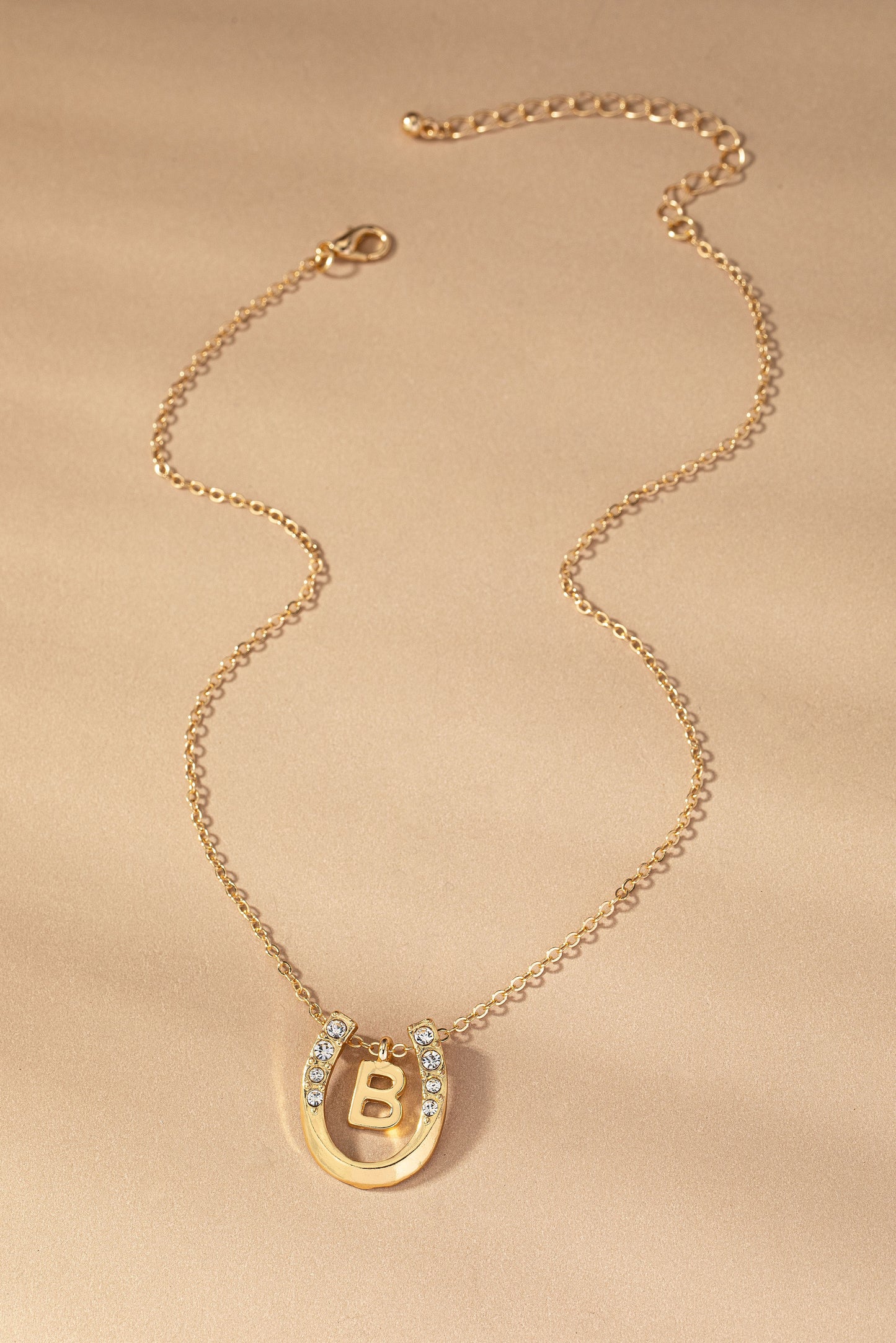Small initial inside horseshoe pendant necklace