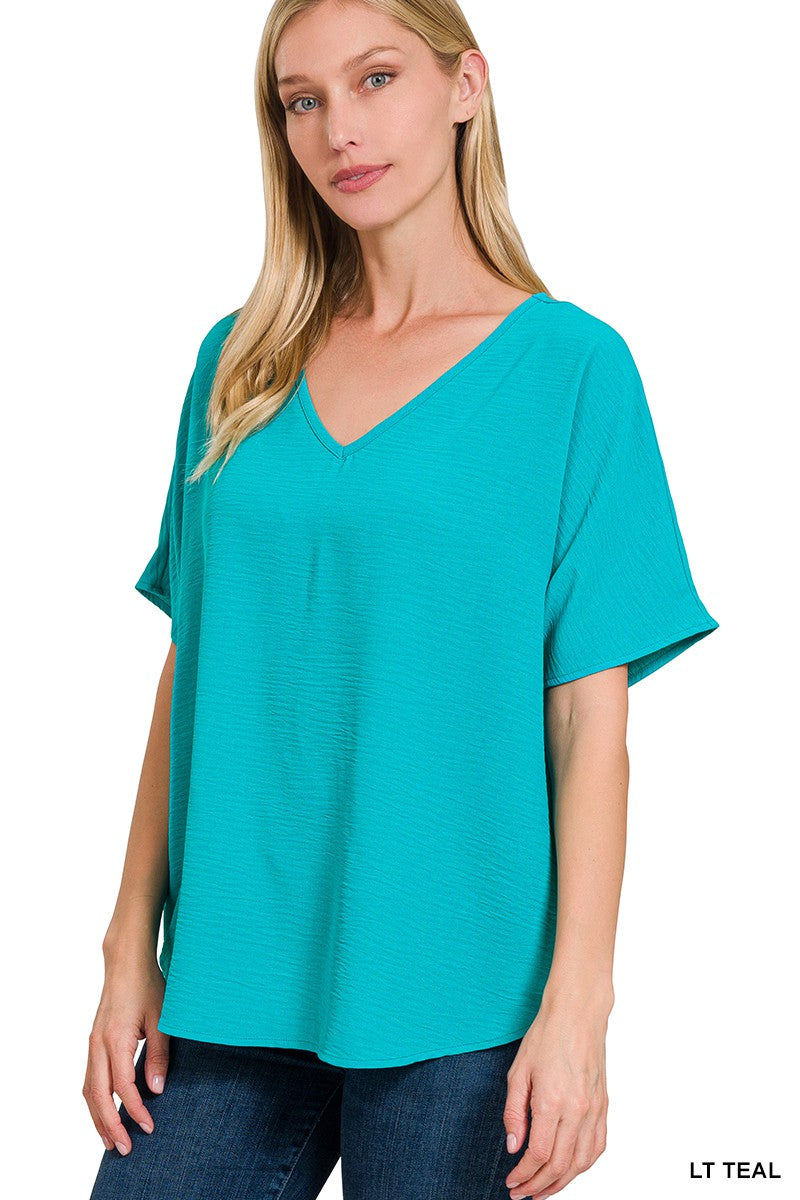 WOVEN AIRFLOW V-NECK SHORT SLEEVE TOP