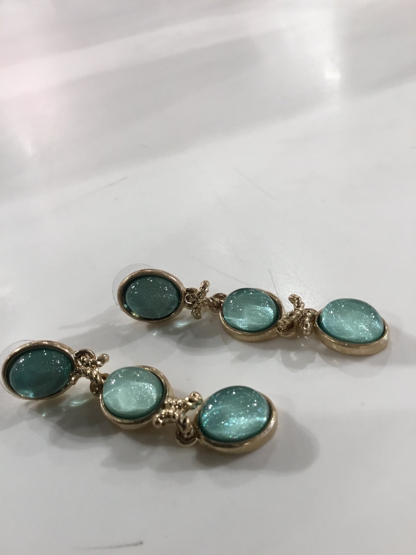 Gold Three Tier Oval Dangle earrings with Aqua stone