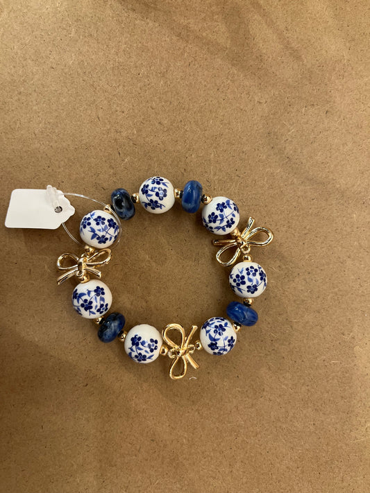 Blue floral gold bowed bracelet