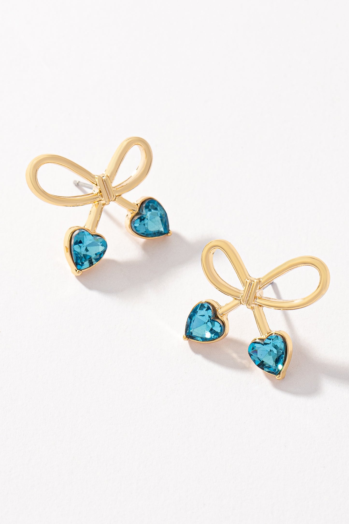 Bowtie earrings with heart shape stones