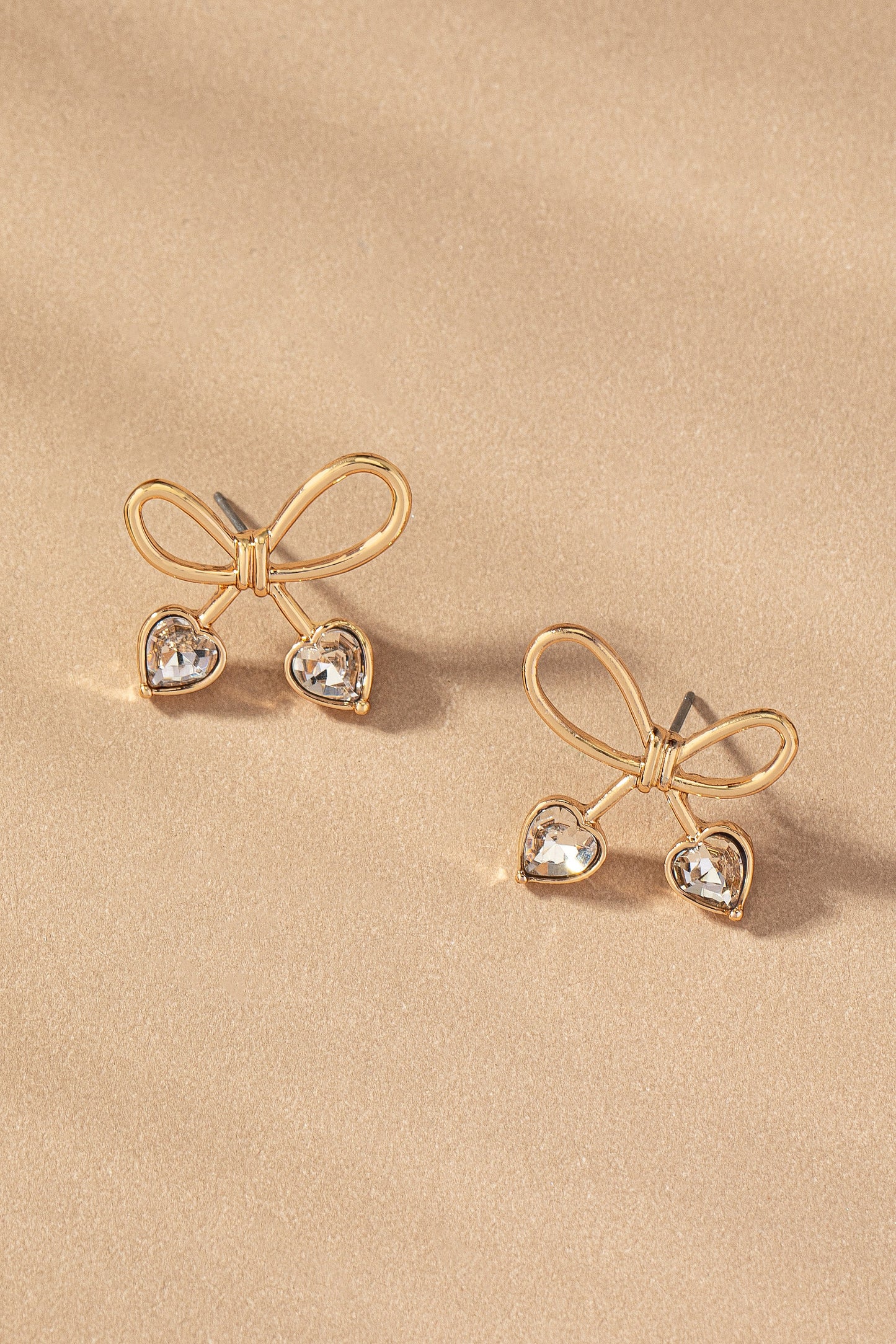 Bow stud earrings with rhinestone heart