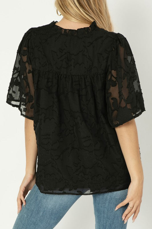 A line blouse with ruffle trim