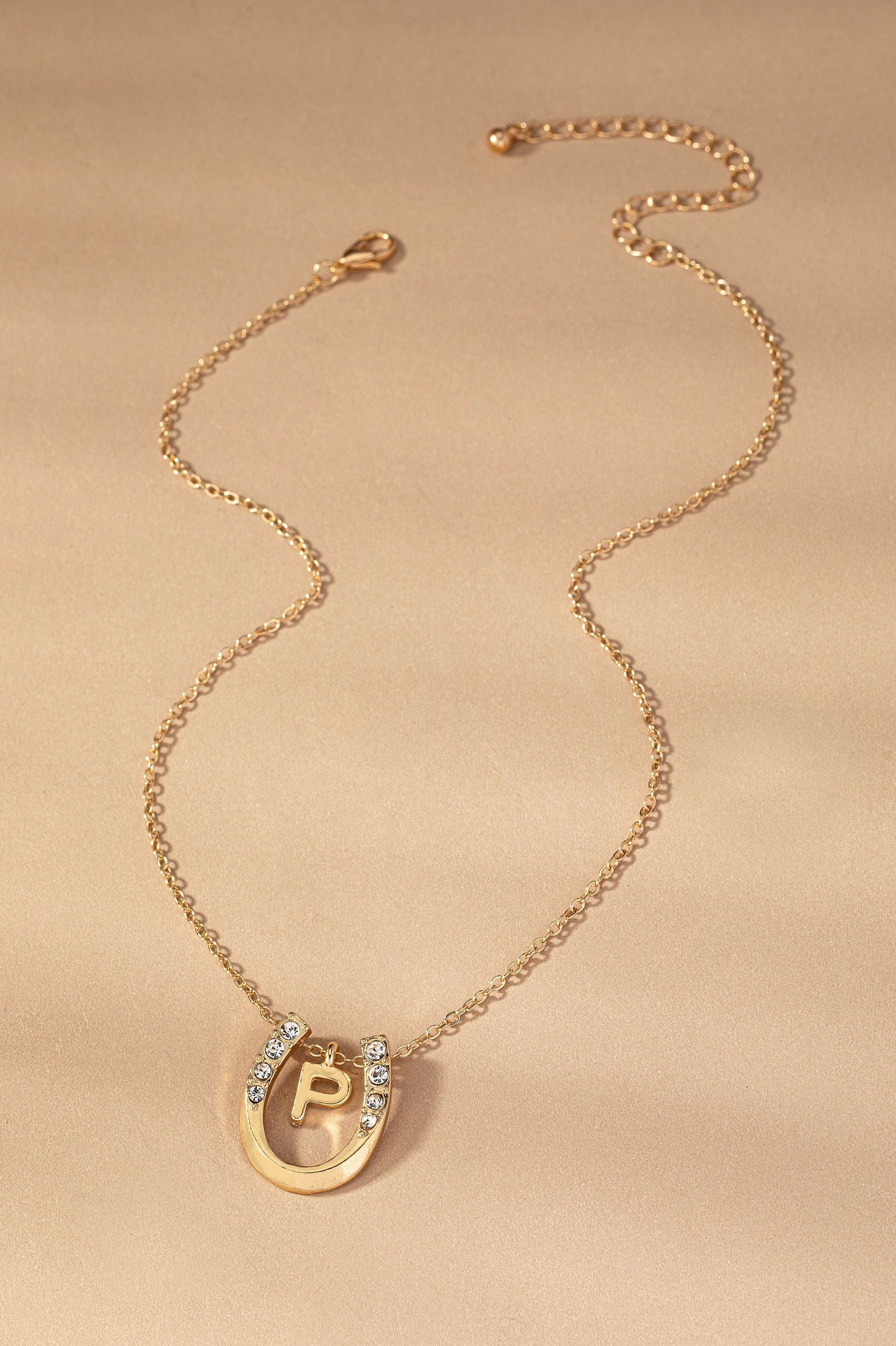 Small initial inside horseshoe pendant necklace