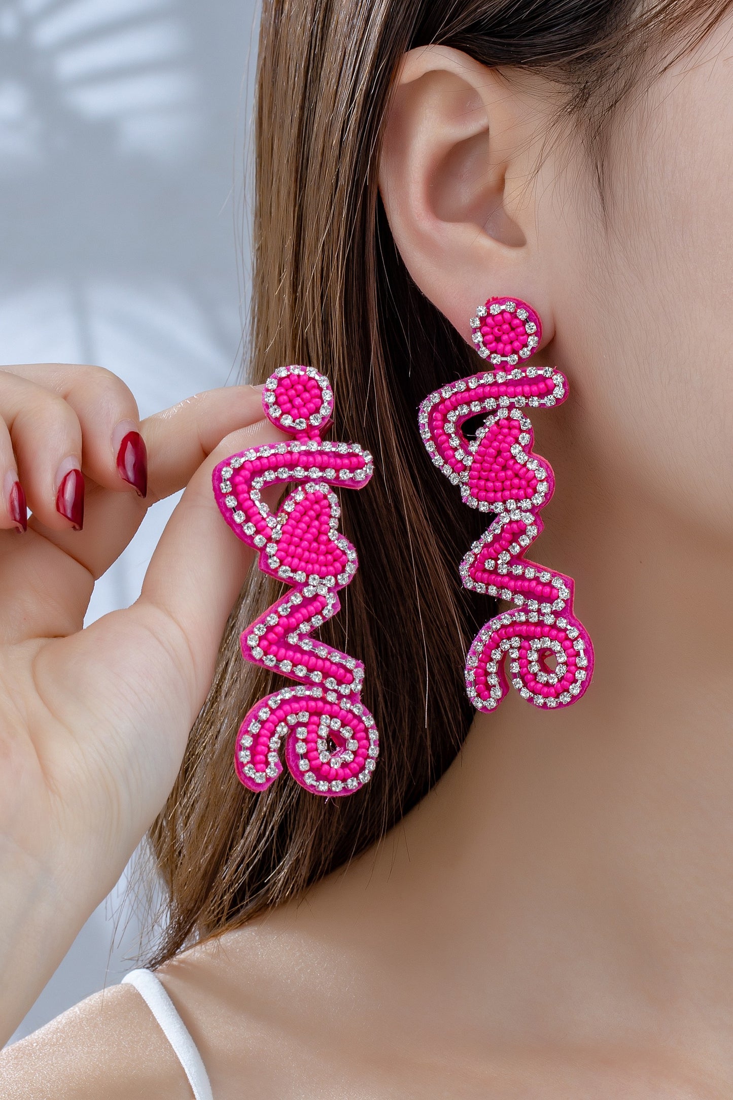 Hot pink love seed earrings