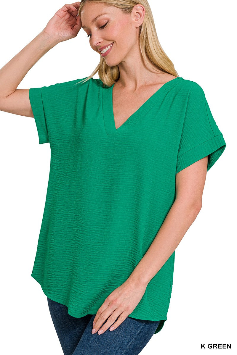 WOVEN AIRFLOW V-NECK HI-LOW HEM TOP